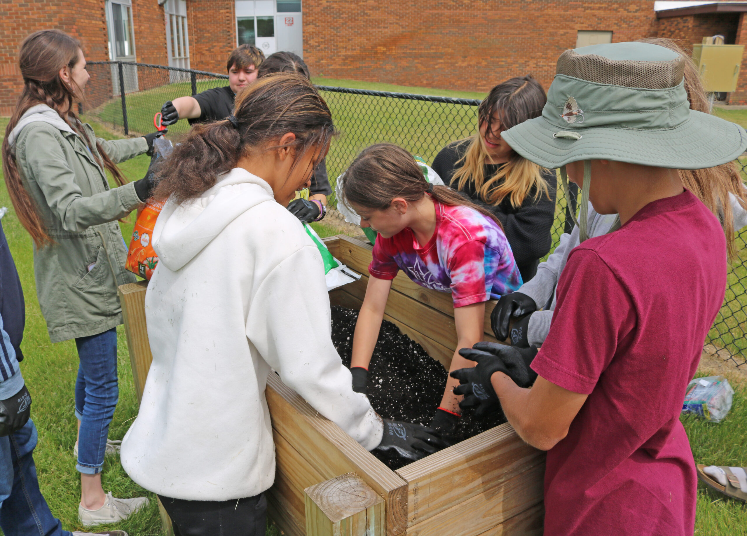 Holton Middle School students at the Out-of-School Time Programs, Project FOCUS, working on raised Garden beds