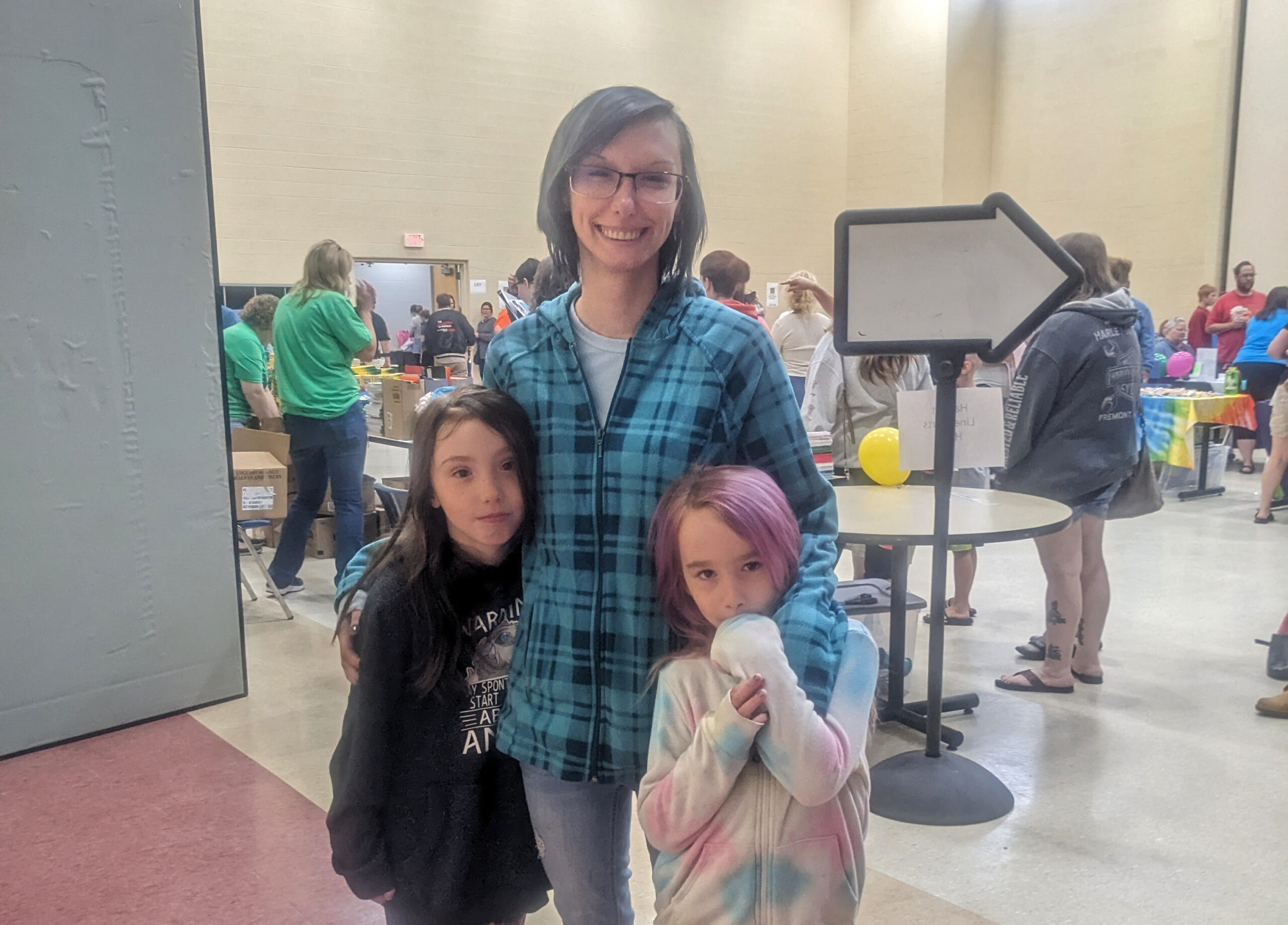 Ashley and her children at Tools for School