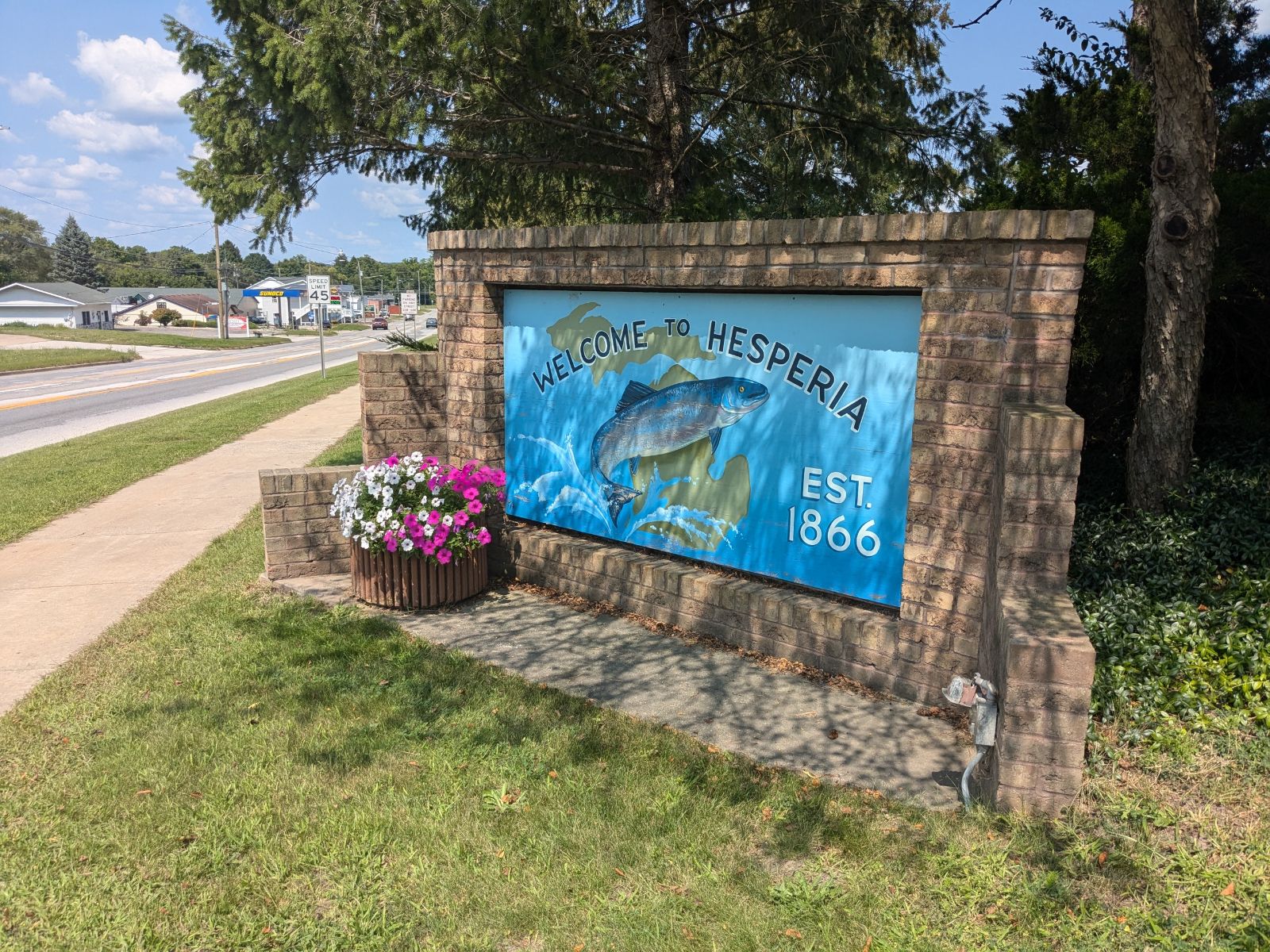 Welcome to Hesperia sign with the community in the background.