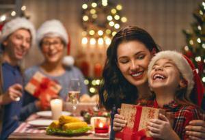 Mom hugging her daughter at Christmas.