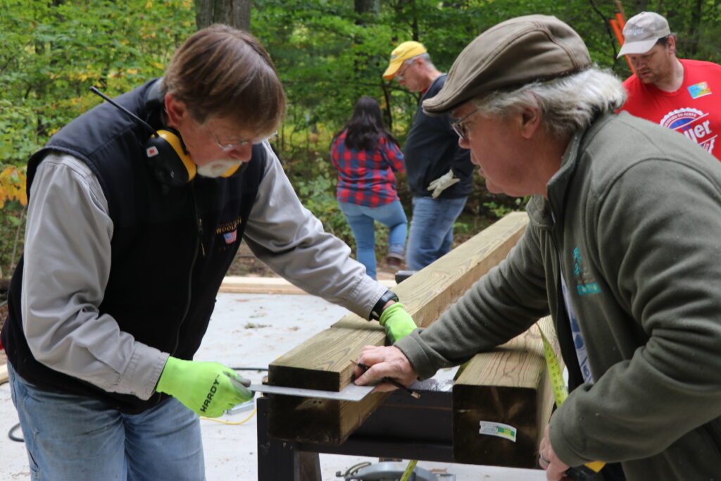 Two men volunteering at Camp Newaygo.