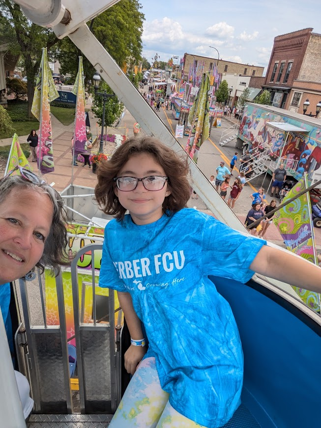 Mentor with her mentee at a community festival.
