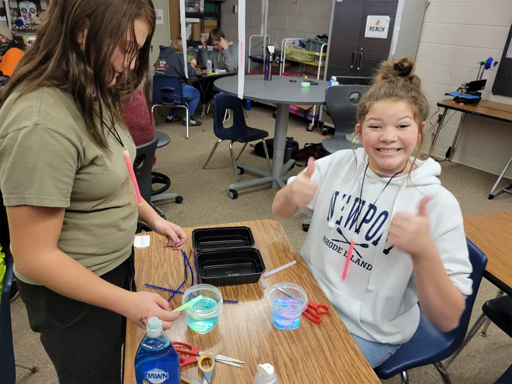 Out of school time students doing arts, crafts, and experiments together