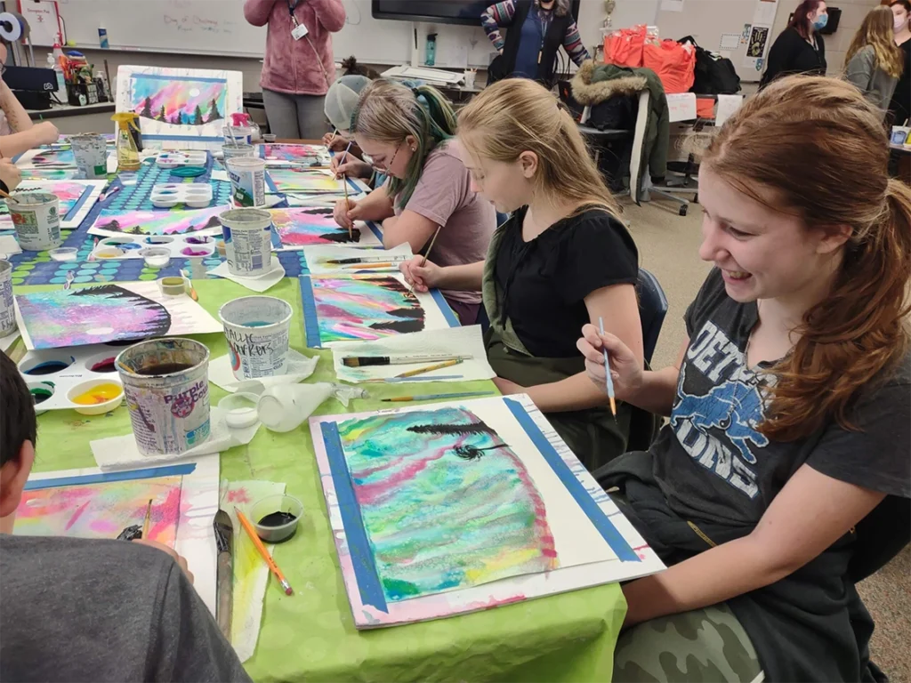 Students creating artwork together