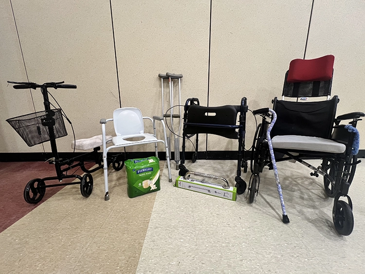 A group of medical items for loan: wheelchair, crutches, walker, etc.